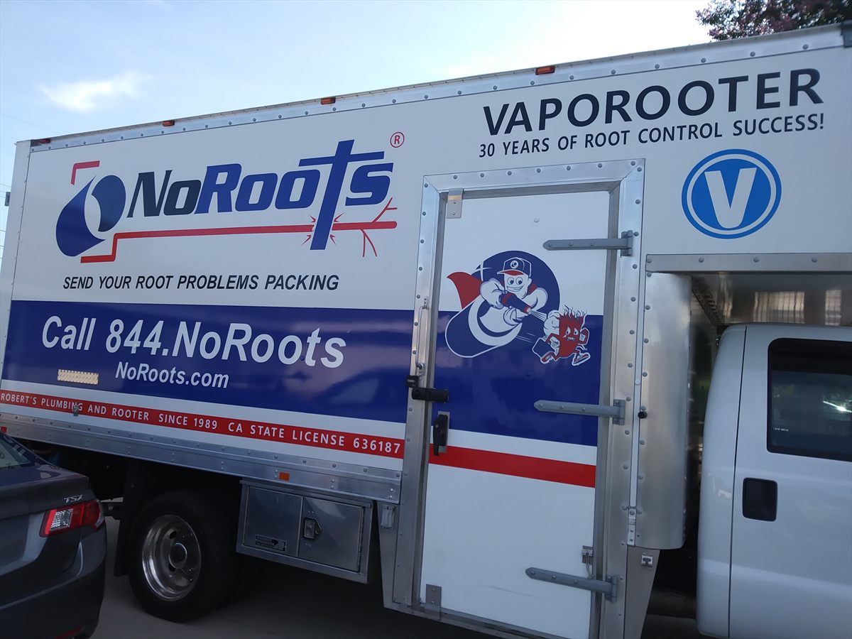 Full-colour printed graphics and lettering wrapping a NoRoots Vaporooter box truck